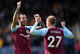 BURNLEY, ENGLAND - APRIL 24: Matej Vydra celebrates with teammate Dwight McNeil of Burnley after scoring their team's first goal during the Premier League match between Burnley and Wolverhampton Wanderers at Turf Moor on April 24, 2022 in Burnley, England. (Photo by Stu Forster/Getty Images)