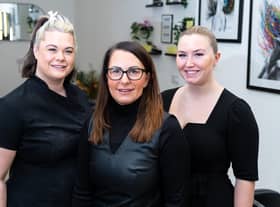 Gail Simpson, owner of Reflections hair and beauty salon, Burnley, (centre) with her daughters,  Michaela Simpson (left) and Maddison Stevenson. Gail is celebrating 31 years owning the business in Rosegrove