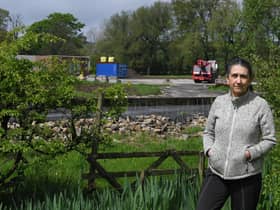 Sheila Cromie who is protesting about applications to remove and alter some of the planning conditions at the Ribchester snail farm and holiday lodge development site which is pictured in the background of the photo      Photo Neil Cross
