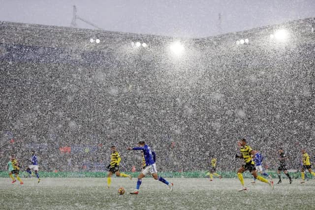 A general view inside the stadium as snow falls during the Premier League match between Leicester City and Watford. (Photo by Richard Heathcote/Getty Images)