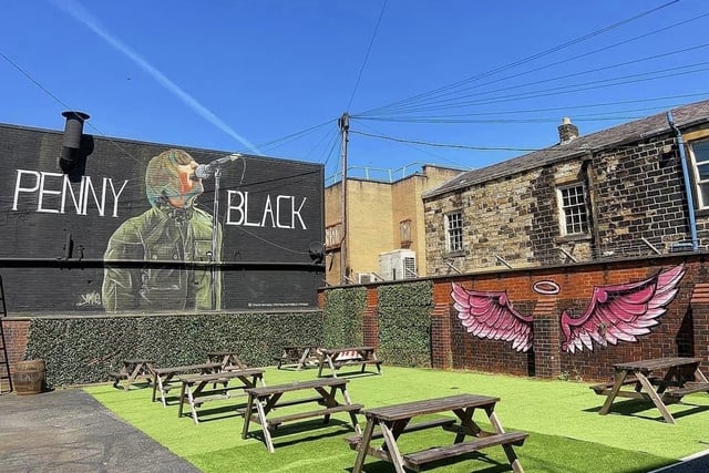 A mural of Liam Gallagher, lead singer of Oasis, in the beer garden of Penny Black in Burnley.