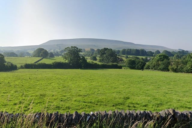 A view of Pendle Hill from the village of Downham