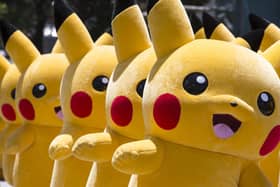 Performers dressed as Pikachu, a character from Pokemon series game titles, march during the Pikachu Outbreak event hosted by The Pokemon Co. on August 7, 2016 in Yokohama, Japan. (Photo by Tomohiro Ohsumi/Getty Images)
