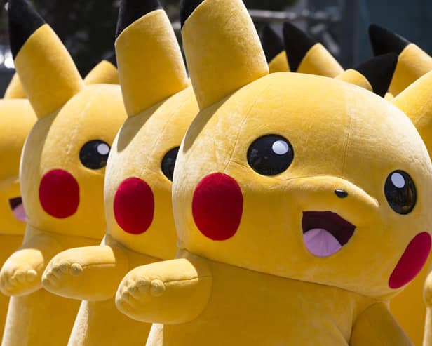 Performers dressed as Pikachu, a character from Pokemon series game titles, march during the Pikachu Outbreak event hosted by The Pokemon Co. on August 7, 2016 in Yokohama, Japan. (Photo by Tomohiro Ohsumi/Getty Images)