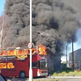 Firefighters tackle a blaze ripping through a double-decker bus in Padiham.