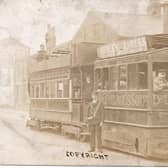 This is one of Burnley’s original steam powered trams. The front part is an engine with a boiler inside (note the chimney) and, at the rear, is the car which carried the passengers. The vehicle is located on Colne Road, at its junction with Brennand Street. Left, note James Slater, wine and spirit merchants and ale and porter bottler.