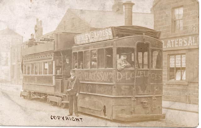 This is one of Burnley’s original steam powered trams. The front part is an engine with a boiler inside (note the chimney) and, at the rear, is the car which carried the passengers. The vehicle is located on Colne Road, at its junction with Brennand Street. Left, note James Slater, wine and spirit merchants and ale and porter bottler.