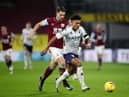 Ollie Watkins of Aston Villa is challenged by James Tarkowski of Burnley during the Premier League match between Burnley and Aston Villa at Turf Moor. (Photo by Clive Brunskill/Getty Images)