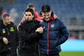 BURNLEY, ENGLAND - FEBRUARY 17:  Mikel Arteta, Manager of Arsenal, embraces his players Declan Rice following the Premier League match between Burnley FC and Arsenal FC at Turf Moor on February 17, 2024 in Burnley, England. (Photo by Stuart MacFarlane/Arsenal FC via Getty Images)