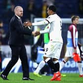 Troy Deeney shakes hands with Sean Dyche during the Premier League match between Burnley and Watford at Turf Moor on September 26, 2016 in Burnley, England.
