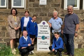 Cliviger schoolchildren at the new milestone marker