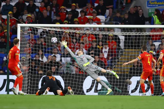 CARDIFF, WALES - JUNE 08: Wout Weghorst of Netherlands scores their sides second goal past Adam Davies of Wales during the UEFA Nations League League A Group 4 match between Wales and Netherlands at Cardiff City Stadium on June 08, 2022 in Cardiff, Wales. (Photo by Michael Steele/Getty Images)