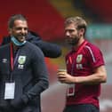 LIVERPOOL, ENGLAND - JULY 11: Jay Rodriguez of Burnley speaks to Charlie Taylor on the pitch prior to the Premier League match between Liverpool FC and Burnley FC at Anfield on July 11, 2020 in Liverpool (Photo by Clive Brunskill/Getty Images)