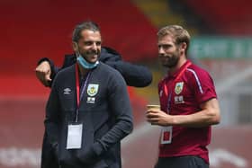 LIVERPOOL, ENGLAND - JULY 11: Jay Rodriguez of Burnley speaks to Charlie Taylor on the pitch prior to the Premier League match between Liverpool FC and Burnley FC at Anfield on July 11, 2020 in Liverpool (Photo by Clive Brunskill/Getty Images)