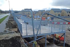 The controversial metal ramp/ walkway that has been constructed at the entrance to the new housing development The Calders in Cliviger