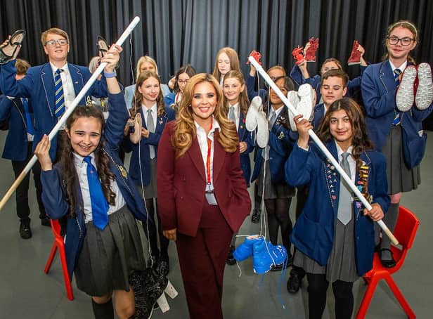 Rebecca Jane, the CEO of RJ8, with students at Blessed Trinity RC College in Burnley who are launching their own mental health charity.
