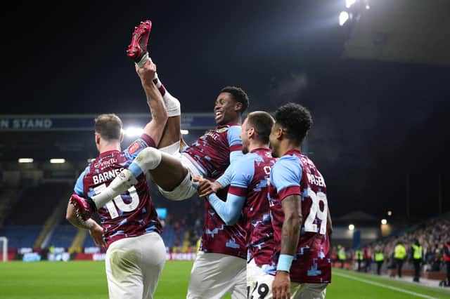 Burnley's Nathan Tella celebrates scoring his side's second goal with teammates

The Emirates FA Cup Fourth Round Replay - Burnley v Ipswich Town - Tuesday 7th February 2023 - Turf Moor - Burnley