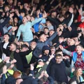 BURNLEY, ENGLAND - NOVEMBER 13: Burnley fans show their support prior to the Sky Bet Championship between Burnley and Blackburn Rovers at Turf Moor on November 13, 2022 in Burnley, England. (Photo by Nathan Stirk/Getty Images)