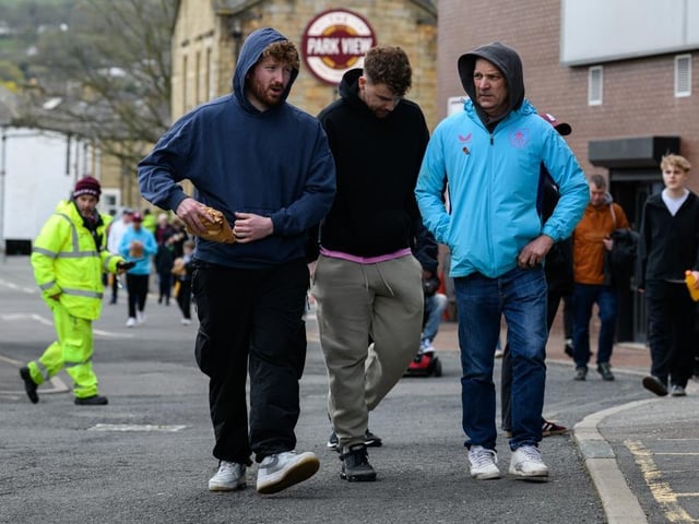 Burnley fans arrive at Turf Moor for the Premier League fixture against Brighton and Hove Albion. Photo: Kelvin Lister-Stuttard