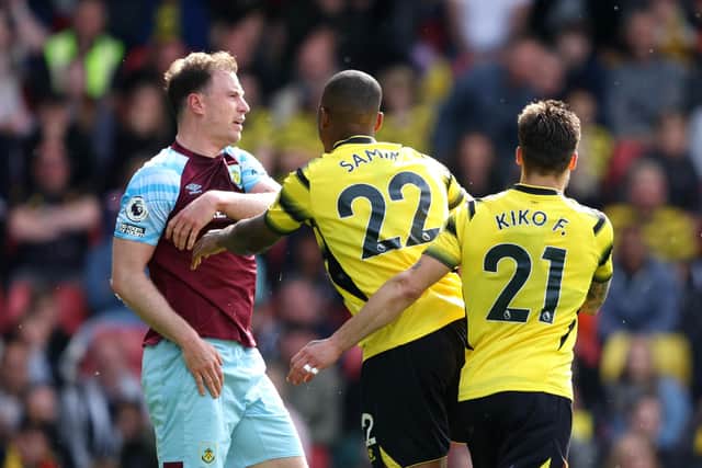 WATFORD, ENGLAND - APRIL 30: Ashley Barnes of Burnley clashes with Samir Caetano de Souza Santos of Watford FC during the Premier League match between Watford and Burnley at Vicarage Road on April 30, 2022 in Watford, England. (Photo by Richard Heathcote/Getty Images)
