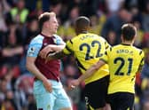 WATFORD, ENGLAND - APRIL 30: Ashley Barnes of Burnley clashes with Samir Caetano de Souza Santos of Watford FC during the Premier League match between Watford and Burnley at Vicarage Road on April 30, 2022 in Watford, England. (Photo by Richard Heathcote/Getty Images)