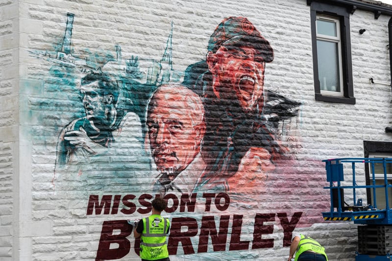 Mission to Burnley mural being painted on the side of a house on Higgin Street opposite Turf Moor. Photo: Kelvin Lister-Stuttard
