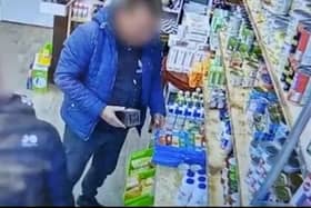 Police are investigating after footage captures two men stealing aftershave from Depher CIC UK's charity shop in Keirby Walk, Burnley.