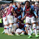 BURNLEY, ENGLAND - NOVEMBER 13: Nathan Tella of Burnley celebrates after teammate Anass Zaroury (obscured) scores their side's second goal during the Sky Bet Championship between Burnley and Blackburn Rovers at Turf Moor on November 13, 2022 in Burnley, England. (Photo by Nathan Stirk/Getty Images)