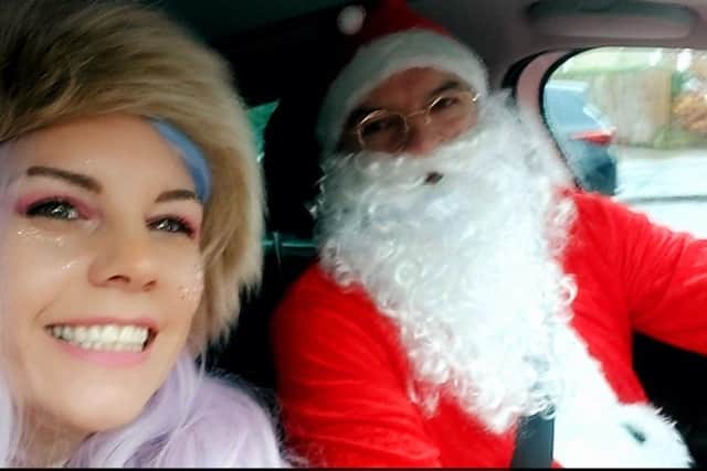 Married couple Beth and Getty Schinkel, of Burnley, dressed up as a fairy and Santa to help spread Christmas magic to children in need.