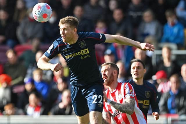 Burnley's Irish defender Nathan Collins (L) vies with Brentford's Swedish defender Pontus Jansson (C) during the English Premier League football match between Brentford and Burnley at Brentford Community Stadium in London on March 12, 2022. - - RESTRICTED TO EDITORIAL USE. No use with unauthorized audio, video, data, fixture lists, club/league logos or 'live' services. Online in-match use limited to 120 images. An additional 40 images may be used in extra time. No video emulation. Social media in-match use limited to 120 images. An additional 40 images may be used in extra time. No use in betting publications, games or single club/league/player publications. (Photo by JUSTIN TALLIS / AFP) / RESTRICTED TO EDITORIAL USE. No use with unauthorized audio, video, data, fixture lists, club/league logos or 'live' services. Online in-match use limited to 120 images. An additional 40 images may be used in extra time. No video emulation. Social media in-match use limited to 120 images. An additional 40 images may be used in extra time. No use in betting publications, games or single club/league/player publications. / RESTRICTED TO EDITORIAL USE. No use with unauthorized audio, video, data, fixture lists, club/league logos or 'live' services. Online in-match use limited to 120 images. An additional 40 images may be used in extra time. No video emulation. Social media in-match use limited to 120 images. An additional 40 images may be used in extra time. No use in betting publications, games or single club/league/player publications. (Photo by JUSTIN TALLIS/AFP via Getty Images)