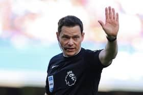 LONDON, ENGLAND - MARCH 30: Darren England, Football Referee, gestures during the Premier League match between Chelsea FC and Burnley FC at Stamford Bridge on March 30, 2024 in London, England. (Photo by Richard Pelham/Getty Images)