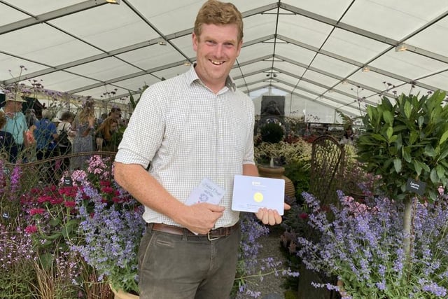 John Foley of Holden Clough Nurseries at Bolton by Bowland celebrates receiving his ninth consecutive gold medal at Tatton for his English Courtyard Garden display  Photo:Fiona Finch