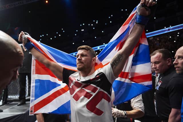 British fighter Michael Bisping walks to the ring for his fight with Anderson Silva of Brazil (not pictured) in their middleweight bout at the Ultimate Fighting Championship (UFC) Fight Night event in London on February 27, 2016.