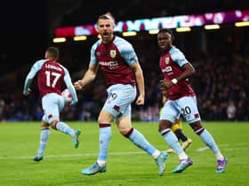 BURNLEY, ENGLAND - APRIL 06: Jay Rodriguez of Burnley celebrates with teammates Aaron Lennon and Maxwel Cornet after scoring their team's second goal during the Premier League match between Burnley and Everton at Turf Moor on April 06, 2022 in Burnley, England. (Photo by Clive Brunskill/Getty Images)
