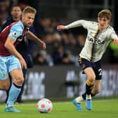 Burnley's English defender Charlie Taylor (L) vies with Everton's English striker Anthony Gordon (R) during the English Premier League football match between Burnley and Everton at Turf Moor in Burnley, north west England on April 6, 2022.