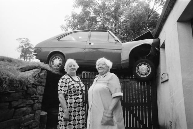 Landlady Mrs Margaret Collinge, left, and her sister, Edith, in front of their surprising “guest”.