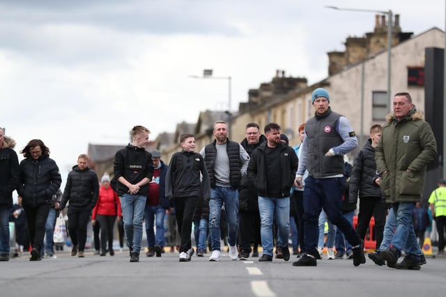 BURNLEY, ENGLAND - APRIL 02: Burnley fans arrive at the stadium prior to the Premier League match between Burnley and Manchester City at Turf Moor on April 02, 2022 in Burnley, England. (Photo by Jan Kruger/Getty Images)
