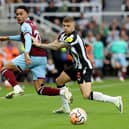NEWCASTLE UPON TYNE, ENGLAND - SEPTEMBER 30: Kieran Trippier of Newcastle United challenges Aaron Ramsey of Burnley during the Premier League match between Newcastle United and Burnley FC at St. James Park on September 30, 2023 in Newcastle upon Tyne, England. (Photo by Nigel Roddis/Getty Images)