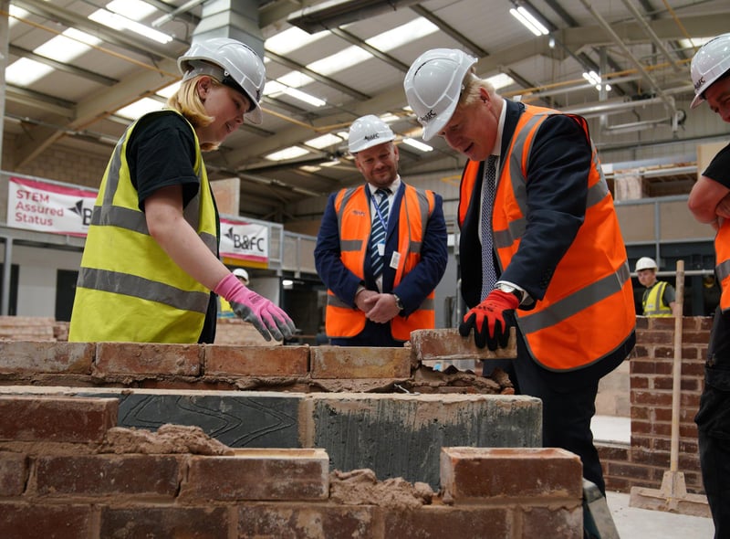 Prime Minister Boris Johnson takes part in a brick laying lesson at Blackpool and The Fylde College