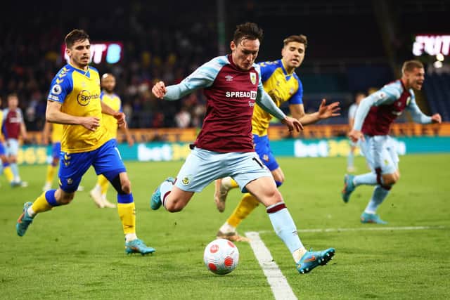 BURNLEY, ENGLAND - APRIL 21: Connor Roberts of Burnley attempts to cross the ball during the Premier League match between Burnley and Southampton at Turf Moor on April 21, 2022 in Burnley, England. (Photo by Clive Brunskill/Getty Images)