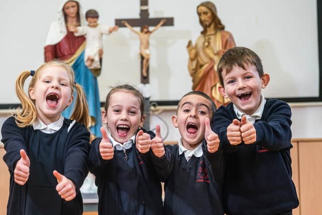A thumbs up from pupils at Burnley's St Augustine's RC Primary School which has received a glowing report from the Catholic School's Inspectorate