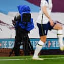BURNLEY, ENGLAND - OCTOBER 26: A television camera films the action during the Premier League match between Burnley and Tottenham Hotspur at Turf Moor on October 26, 2020 in Burnley, England. (Photo by Michael Regan/Getty Images)