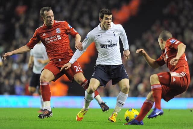 Liverpool's Scottish midfielder Charlie Adam (L) vies with Tottenham Hotspur's Welsh defender Gareth Bale (C) and Liverpool's English midfielder Jay Spearing during the English Premier league football match between Liverpool and Tottenham Hotspur at Anfield in Liverpool, north-west England, on February 6, 2012.