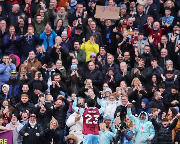 BURNLEY, ENGLAND - MARCH 16: David Datro Fofana of Burnley celebrates with the fans after scoring his team's second goal during the Premier League match between Burnley FC and Brentford FC at Turf Moor on March 16, 2024 in Burnley, England. (Photo by Matt McNulty/Getty Images)
