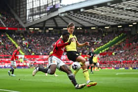 MANCHESTER, ENGLAND - APRIL 27: Kobbie Mainoo of Manchester United is challenged by Sander Berge of Burnley during the Premier League match between Manchester United and Burnley FC at Old Trafford on April 27, 2024 in Manchester, England. (Photo by Michael Regan/Getty Images)