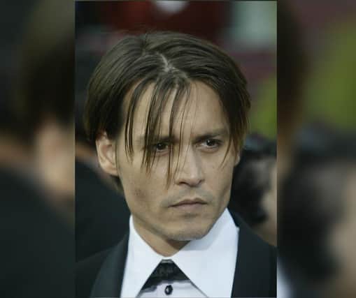 Johnny Depp arrives for the 76th Academy Awards ceremony 29 February, 2004 at the Kodak Theater in Hollywood, CA, after being nominated for Best Actor for his performance in "Pirates of the Caribbean: The Curse of the Black Pearl." Credit: Jeff HAYNES/AFP via Getty Images.