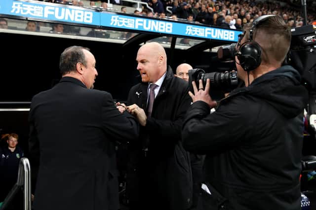 NEWCASTLE UPON TYNE, ENGLAND - FEBRUARY 26:  Sean Dyche, Manager of Burnley and Rafael Benitez, Manager of Newcastle United shake hands prior to the Premier League match between Newcastle United and Burnley FC at St. James Park on February 26, 2019 in Newcastle upon Tyne, United Kingdom.  (Photo by Clive Brunskill/Getty Images)