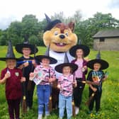 Paints at the ready – children and Penny, the hospice mascot, prepare for the Pendleside Witchfest art competition