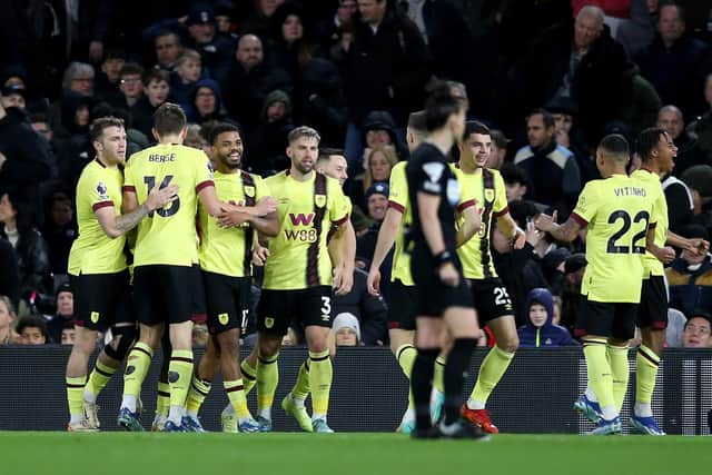 LONDON, ENGLAND - DECEMBER 23: Wilson Odobert of Burnley celebrates with teammates after scoring their team's first goal during the Premier League match between Fulham FC and Burnley FC at Craven Cottage on December 23, 2023 in London, England. (Photo by Steve Bardens/Getty Images)