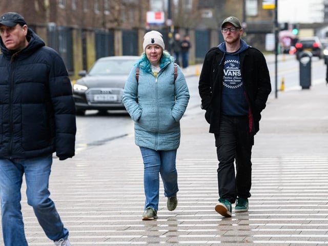 Burnley fans arrive at Turf Moor for the Premier League fixture against West Ham United. Photo: Kelvin Lister-Stuttard